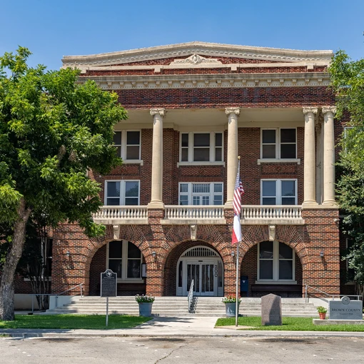 Historic brick building with columns - towing service in Brownwood