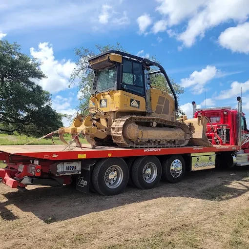 Bulldozer on flatbed truck - Towing Service in Goldthwaite